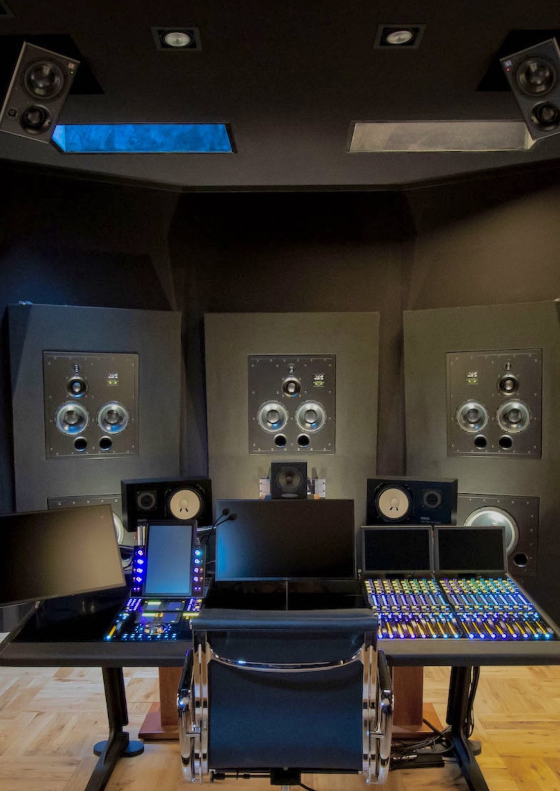 Mixing control room in Paris, three flush-mounted main speakers, ceiling speakers and a mixing console