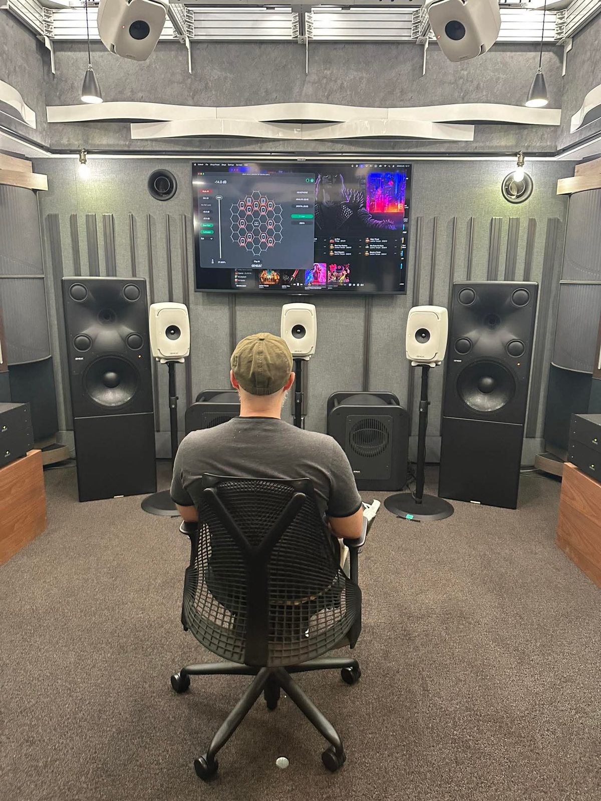 Immersive mixing room in Tokyo, ceiling speakers and absorbing panels on the walls