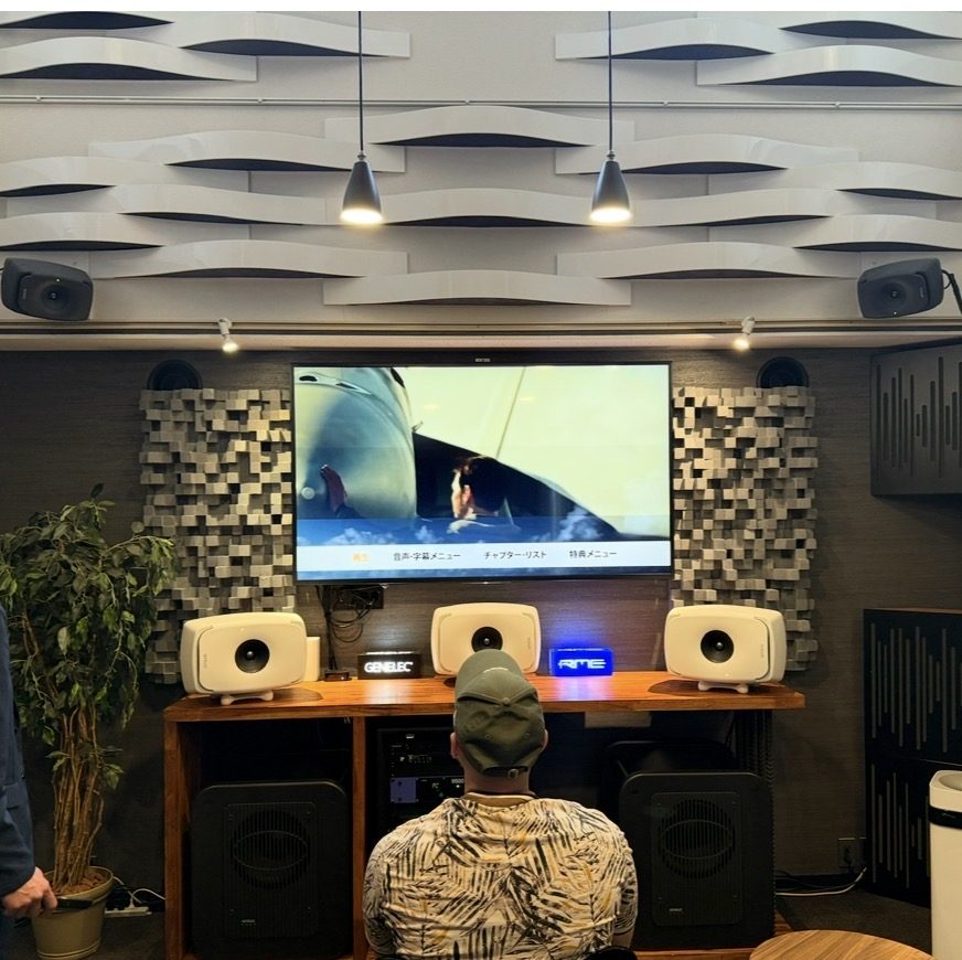 Listening room in Tokyo, wave-shaped ceiling diffusers, diffusing panels and monitor speakers in front of a large screen